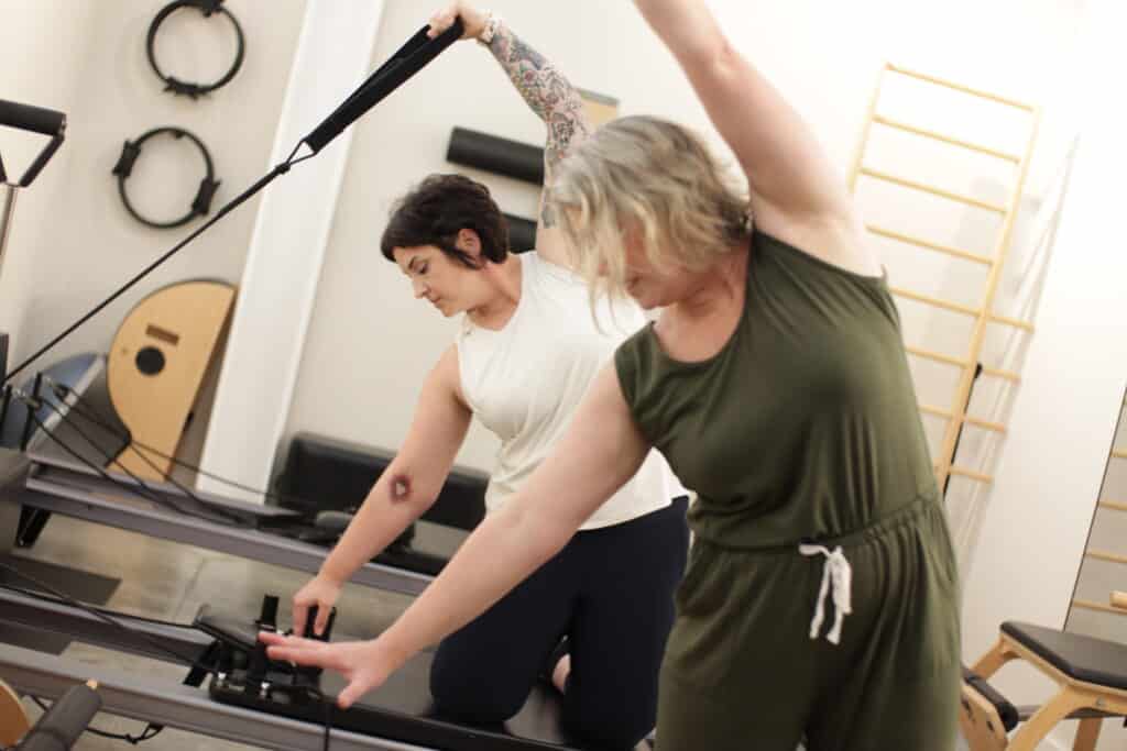 private pilates nashville instructor with client on the reformer